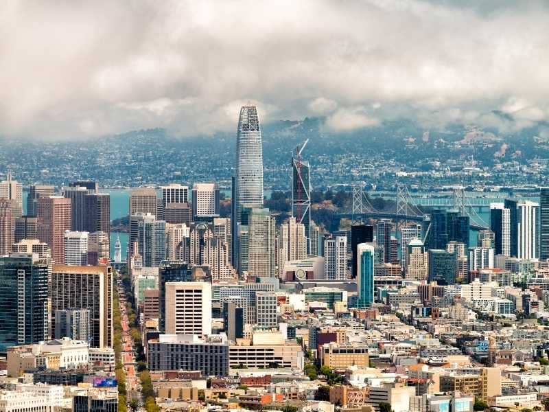 Downtown San Francisco, California skyline with high-rise buildings, transportation infrastructure, and surrounding urban development areas relevant to land surveying and site planning